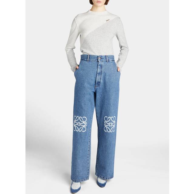 Anagram Logo Baggy Jeans - Blue - The denim offering from Loewe this AW25 spotlights sculptural silhouettes and signature Anagram embroidery — take these baggy jeans. Sitting mid-rise at the waist, they’re cut to a wide, slouchy silhouette with belt loops for an adjustable fit and multiple pockets for everyday functionality. Anagram logos stamped at each knee complete the look for an unmistakable edit.