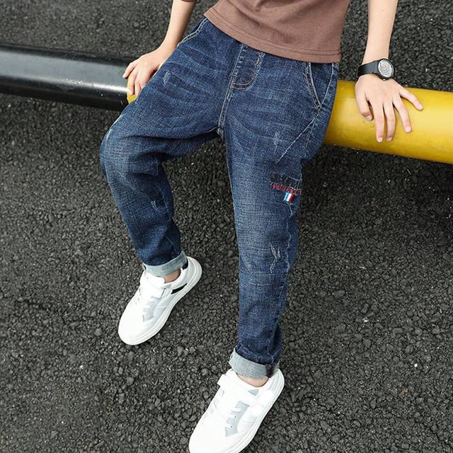 SHEIN Tween Boy Elastic Loose Fit Jeans, Random Stitched Brand Marks, Spring & Autumn