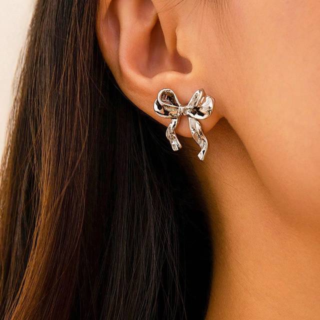 SHEIN 1pair Elegant Gold & Silver Bow Earrings, Ladies Metal Ribbon Earrings Gift (Includes White Pad Or Clear Earplug To Prevent Earring Needle From Pierci