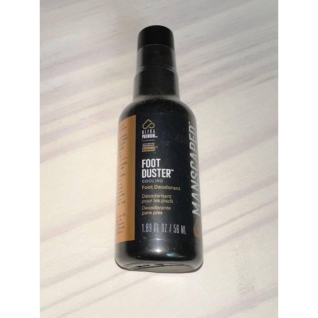 MANSCAPED The Foot Duster  Men's Cooling & Soothing Foot Deodorant Spray  Featuring Tea Tree  Coconut  Peppermint Oil  Refined Scent  1.89 fl. oz.