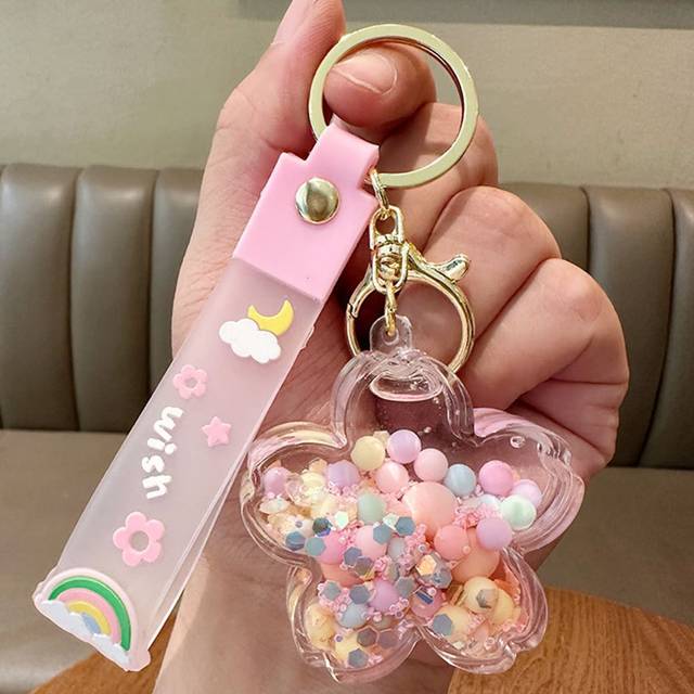 SHEIN Fashionable Creative Oil Filled Floating Cherry Blossom Pendant Drift Bottle Decoration Car Accessories Women Key Chain Charms Cute Stuff