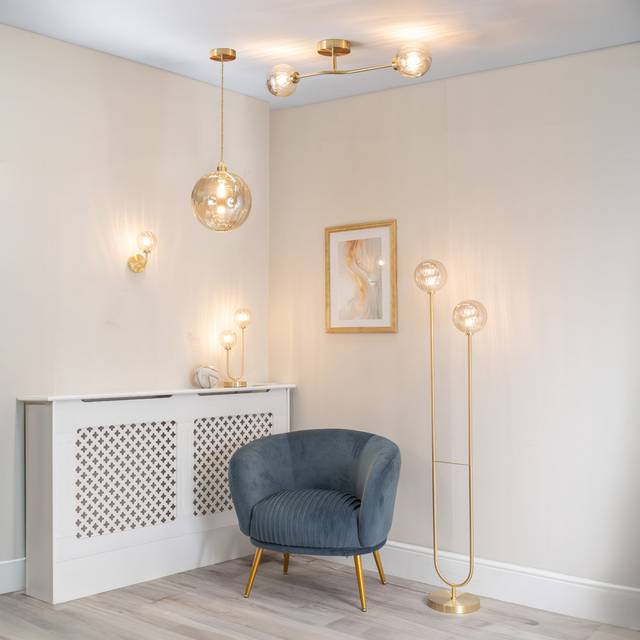 Valuelights - Chessy Pair of - Gold Metal Curved Wall Light with Amber Ribbed Glass Globe Shade