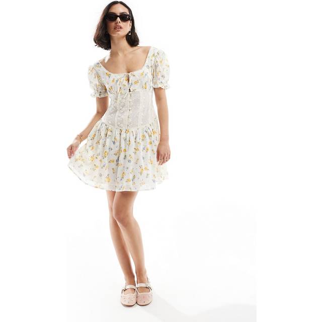 ASOS DESIGN – Blå, gulblommig miniklänning med puffärmar och spetsmidja-Flera