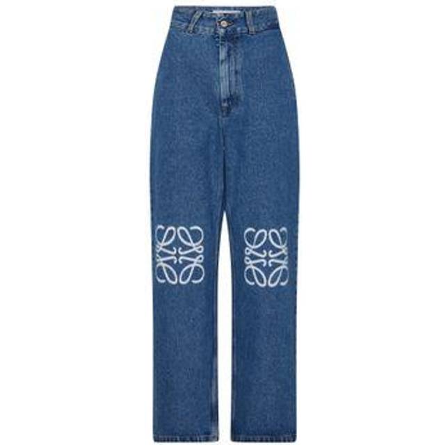 Anagram Logo Baggy Jeans - Blue - The denim offering from Loewe this AW25 spotlights sculptural silhouettes and signature Anagram embroidery — take these baggy jeans. Sitting mid-rise at the waist, they’re cut to a wide, slouchy silhouette with belt loops for an adjustable fit and multiple pockets for everyday functionality. Anagram logos stamped at each knee complete the look for an unmistakable edit.