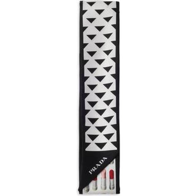 Logo Printed Silk Twill Skinny Scarf - Black - In 1913, Mario Prada opened the very first Prada store in the luxurious Galleria Vittorio Emanuele II in Milan, selling bags, trunks and travel accessories. In the '70s, the brand expanded its range to include footwear, belts and more, all highlighting a design aesthetic that transcends trends. A sleek, understated triangle logo is the seal of authenticity and proudly adorns many of the fashion houses pieces.