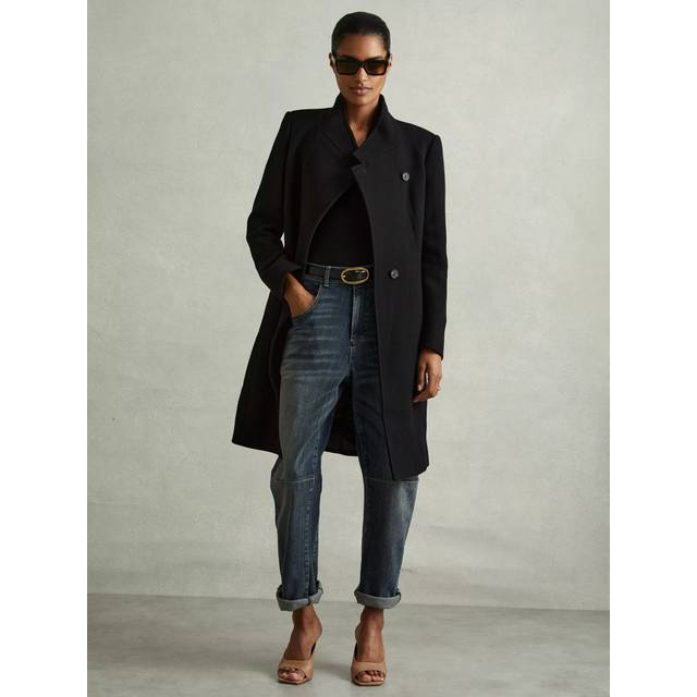 Maude Double-Breasted Coat - BLACK - Beginning with men's tailoring in 1970's London, Reiss' design philosophy has endured for over five decades, maintaining the distinctive tailoring, sharp cuts, and contemporary prints it has become famous for to create investment pieces destined to stay in your wardrobe for seasons to come.