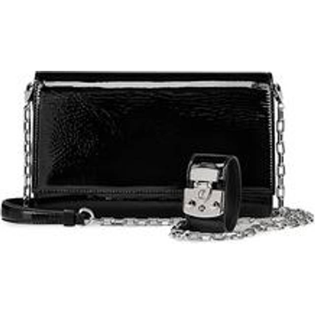 Paloma Patent Clutch - BLACK - The opening of Christian Louboutin's first boutique in 1991 was the beginning of the maison’s red-soled history. Credited with reintroducing stilettos back into fashion, the signature red sole became the luxurious trademark of each Louboutin design. Over three decades later, this longstanding brand continues to craft exquisite shoes and accessories, maintaining the iconic dash of colour it has forever championed.