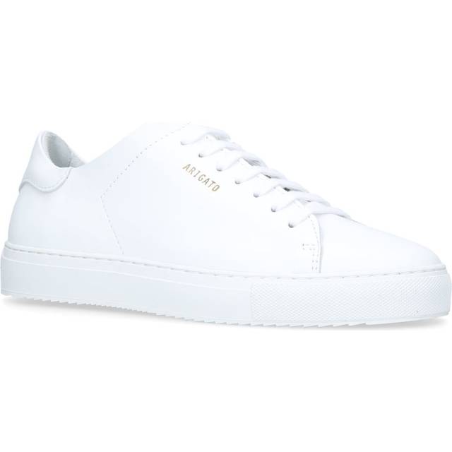 Clean 90 Trainers - WHITE - <p>For the perfect pair of tennis trainers, look no further than Axel Arigato. Using fine leather, super-luxe detailing and pared-back finishes, the Clean 90 trainers are a flawless design. Wear yours with everything from denim to midi dresses.</p>