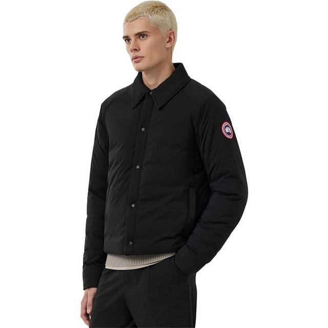 Lodge Coach Jacket - Black - Canadian brand Canada Goose has been designing outerwear for harsh weather conditions since 1957. Since then, the label has expanded and now offers clothing and accessories to compliment it's protective coats and jackets, keeping those who love the great outdoors warm and stylish no matter the environment.