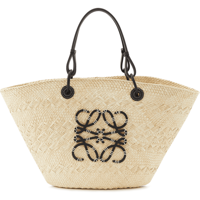 Anagram Medium Bucket Bag - Natural Black - LOEWE's Paula's Ibiza 2025 collection returns this year and continues to capture the bohemian summer spirit of the Mediterranean island. This season feels like you're walking through the iconic boutique with an offering of care-free and '70s-inspired bags and accessories; each piece brings the breezy attitude and freedom you'd expect when visiting the much-revered vacation spot.