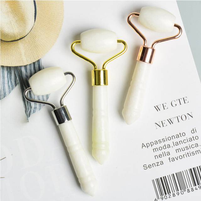 White beauty device in single hand-held beauty massage roller, retro face and eye lifting massage stick