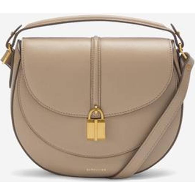 Vancouver Saddle Leather Crossbody Bag - Dark Sand - Founded in 2017 with a vision of empowerment, DeMellier's creations are designed in London and handcrafted by artisans in Europe. Blending heritage and modernity, the name reflects founder Mireia’s Spanish and French roots, capturing tradition and innovation in every design.
