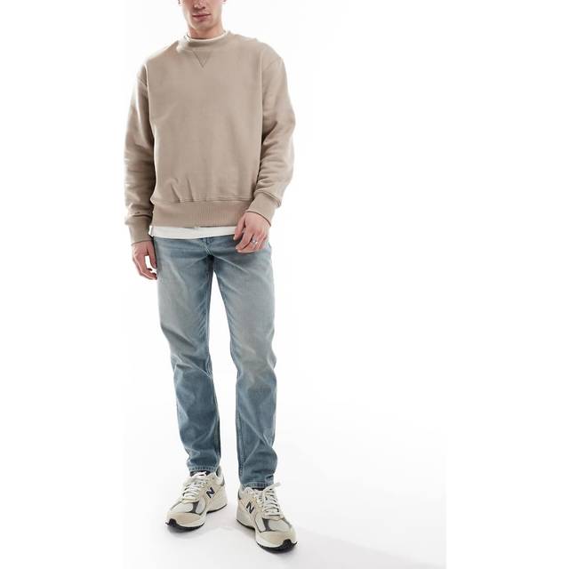 ASOS DESIGN – Ljusblå, avsmalnande jeans