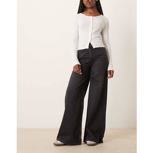 ASOS DESIGN – Bleksvarta jeans med vida ben-Svart/a