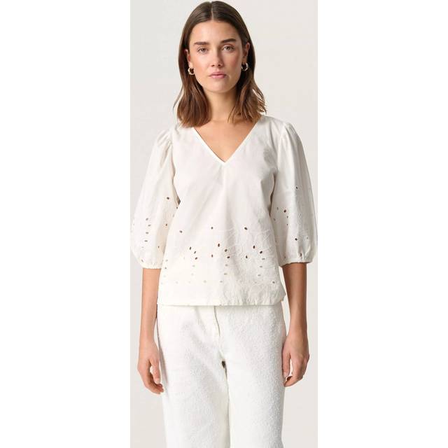 Manja Patterned Puff Sleeve Top - Broken White - Copenhagen-based brand Soaked In Luxury champions sophisticated yet accessible style, delivering a range of wardrobe staples each season that showcases the label's refined design aesthetic. Minimalistic every day basics, flowing feminine dresses and tailored workwear are at the core of each collection, all crafted with the purpose of transcending seasons so you get more out of your favourite pieces.