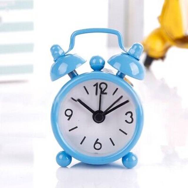 Vintage analog clock with double bell alarm perfect for gentle wake up calls