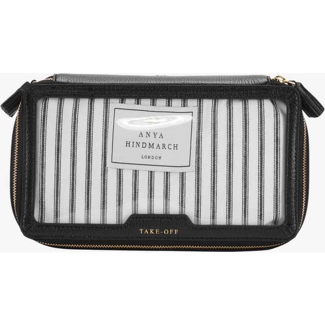 Logo In-Flight Travel Pouch - Clear/Black - With an entrepreneurial spirit, Anya Hindmarch founded her eponymous company from her kitchen table in 1987. The luxury brand has since gone global and is renowned for its elite craftsmanship and whimsical creativity, offering fashion accessories that incorporate 'British humour and personality'. From quirky googly eyes on bags to the use of British household brands in her designs, imagination is at the heart of every product.