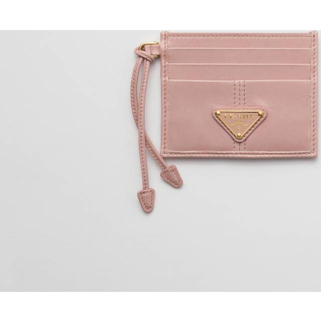 Leather Logo Cardholder - Pink - In 1913, Mario Prada opened the very first Prada store in the luxurious Galleria Vittorio Emanuele II in Milan, selling bags, trunks and travel accessories. In the '70s, the brand expanded its range to include footwear, belts and more, all highlighting a design aesthetic that transcends trends. A sleek, understated triangle logo is the seal of authenticity and proudly adorns many of the fashion houses pieces.