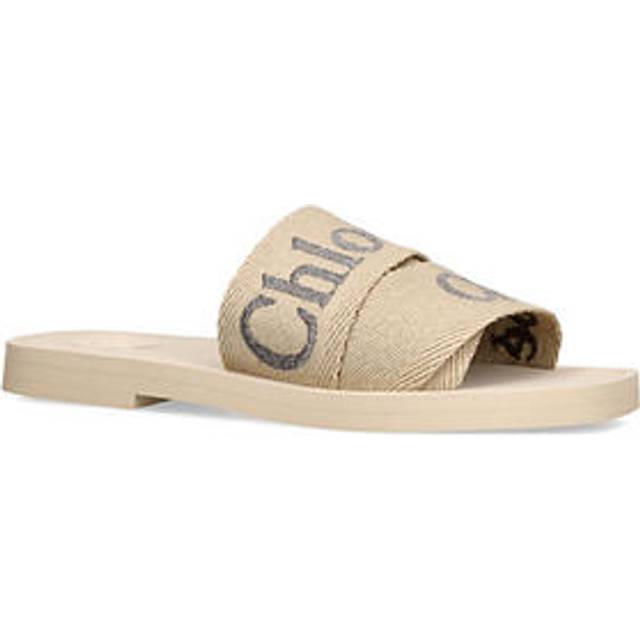 Woody Flat Sandals - WHITE - Carefree and bohemian-inspired best describes the creations from Chloé's collections. From its impeccably crafted accessories to everyday footwear, each design delivers on the label's signature free-spirited style.