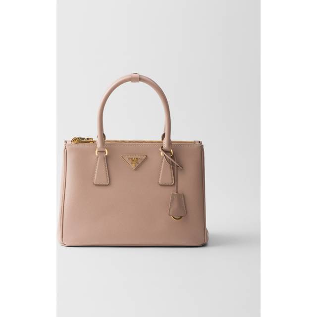 Galleria Medium Saffiano Leather Bag - Powder - In 1913, Mario Prada opened the very first Prada store in the luxurious Galleria Vittorio Emanuele II in Milan, selling bags, trunks and travel accessories. In the '70s, the brand expanded its range to include footwear, belts and more, all highlighting a design aesthetic that transcends trends. A sleek, understated triangle logo is the seal of authenticity and proudly adorns many of the fashion houses pieces.