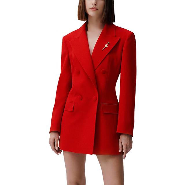 The IT Blazer - Red - Emily Ratajkowski's capsule collection with Marella focuses on creating tailored blazers as hero pieces, combining her signature bold style with the brand's refined aesthetic. The range features intricate detailing like cut-out panels, belted and sheer finishes, offering versatile yet sophisticated designs for day and evening wear.