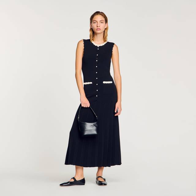 Crochet Embellished Flared Dress - Black - Evelyne and Didier Chetrite founded Sandro in 1984, setting up shop in Paris. The brand's design aesthetic is inspired by Evelyne's childhood in Morocco and classic Parisian chic style, resulting in collections filled with flowing silhouettes, feminine details and vibrant hues and prints. Offering an array of wardrobe staples, occasionwear and accessories, there is something for everyone.