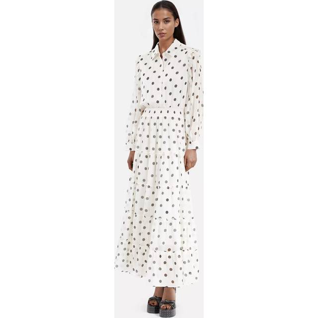 Polka Dot Shirt Dress - WHI09 - Rock culture, sharp tailoring and Parisian nights are at the core of the DNA that informs French label The Kooples design aesthetic. Founded in 2008 by the Elicha brothers, each collection largely features everyday wardrobe staples including simple basics, structured suits and statement accessories. Each piece is finished with sleek details and offers the edgy aesthetic that the brand is known for.
