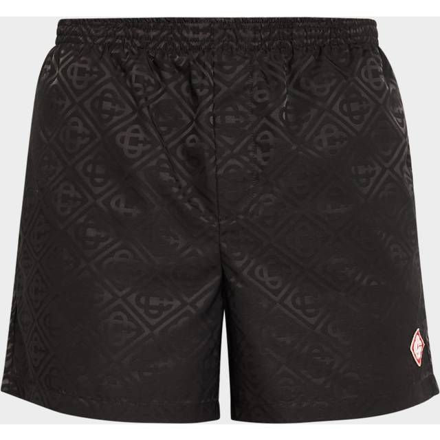 Tonal Logo Swim Shorts - Black - Casablanca references the founder's French-Moroccan identity and fuses it with the reimagining of the timeless après-sport aesthetic. With the use of Neapolitan tailoring techniques to create statement pieces, the brand is the perfect combination of comfort and elegance.