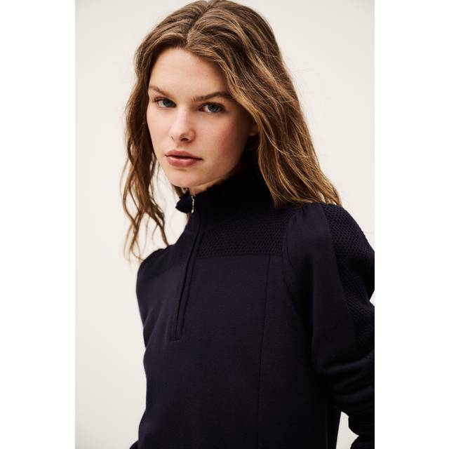 Suzanne Half-Zip Ruffle Sweater - BLUE - Add a touch of Parisian flair to your weekly edit with ba&sh, a brand built on the foundation of Barbara Boccara and Sharon Krief’s childhood friendship and passion for fashion. With a focus on providing staples for your everyday wardrobe that can transcend seasons, the label offers everything from basics to outerwear and occasionwear, all finished with intricate details and brimming with a lively, joyful elegance.