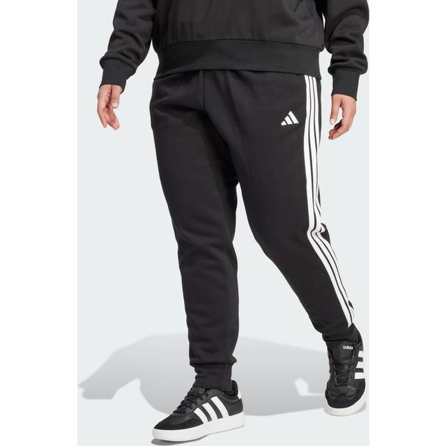 Essentials 3-Stripes slimmade byxor i fleece (Plus Size) - 3X