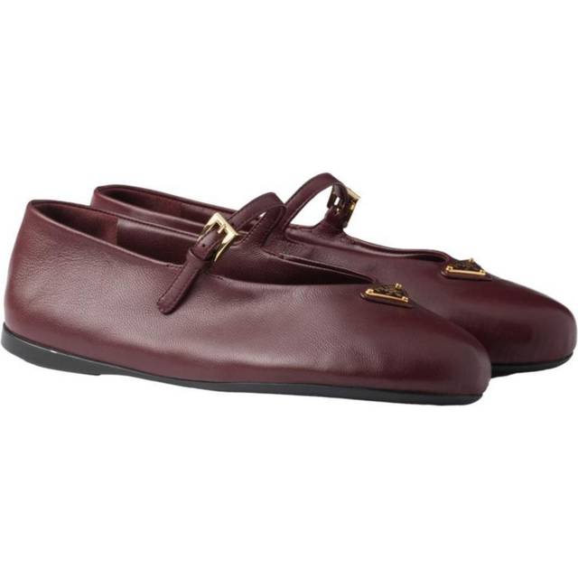 Logo Ballet Flats - Burgundy - In 1913, Mario Prada opened the very first Prada store in the luxurious Galleria Vittorio Emanuele II in Milan, selling bags, trunks and travel accessories. In the '70s, the brand expanded its range to include footwear, belts and more, all highlighting a design aesthetic that transcends trends. A sleek, understated triangle logo is the seal of authenticity and proudly adorns many of the fashion houses pieces.
