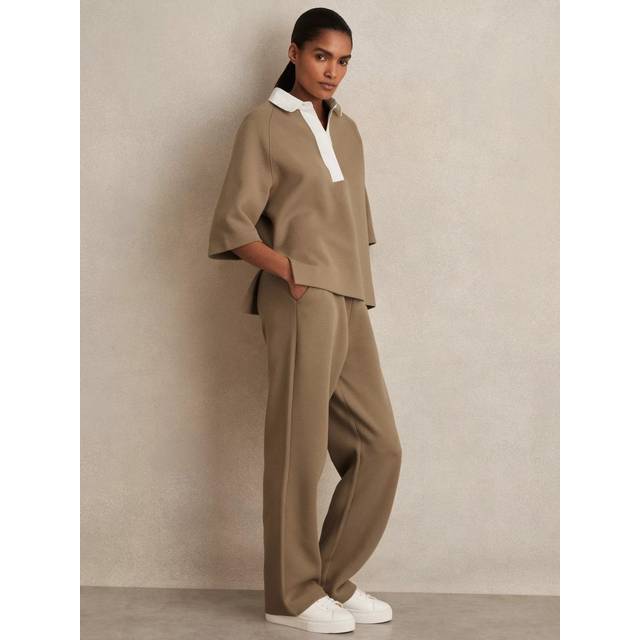 Gaia Interlock Wide Leg Track Pants - CAMEL - Beginning with men's tailoring in 1970's London, Reiss' design philosophy has endured for over five decades, maintaining the distinctive tailoring, sharp cuts, and contemporary prints it has become famous for to create investment pieces destined to stay in your wardrobe for seasons to come.