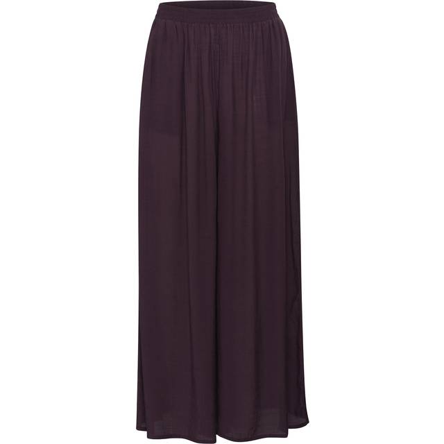Anja Wide Leg Trousers - Fudge - Danish brand KAFFE has been offering timeless collections adorned with feminine details since 1993. The label offers a range of versatile, minimalistic styles that look and feel great, making your daily edit stylish and effortless.