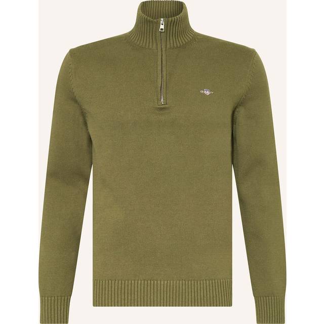 Half-Zip Sweater - 303 Moss Green - Turn to GANT for polished, casual staples with timeless sensibilities. A champion of American sportswear styling since its beginnings in New Haven, Connecticut, this brand continues to push its archive aesthetic into the future, with an eye to challenge convention and deliver new takes on absolute classics.