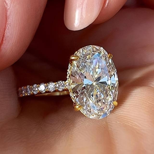 TEMU Elegant Oval-cut Synthetic Zirconia Engagement Ring For Women - Classic 4-prong Setting With Sparkling Accent Stones, Golden-tone Band, Weddings, Proposals, And Valentine's Day Gifts